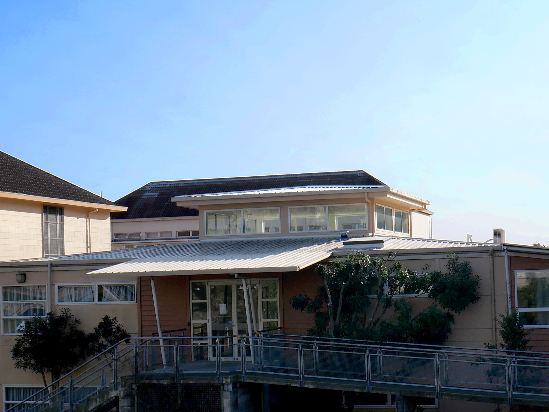 Nelson College: a school building with a new roof and a raised walkway