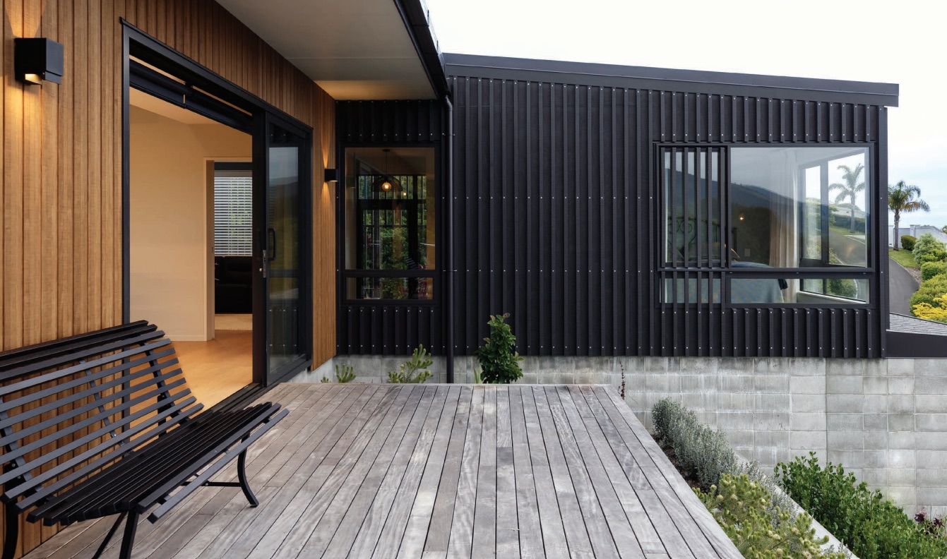 A Richmond home with dark cladding, timber accents and an entry courtyard